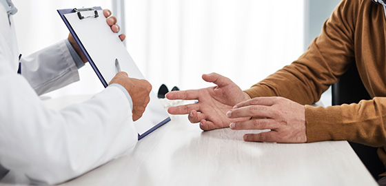 doctor discussing options with patient during consultation showing hands and clipboard related to health care 2 possible outcomes